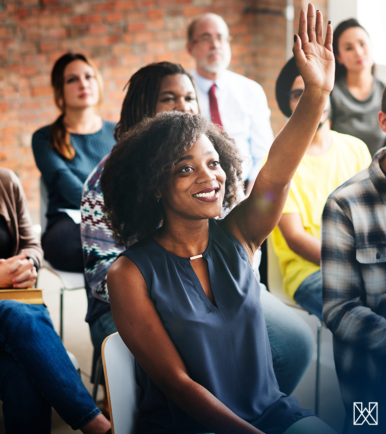 woman raising a hand